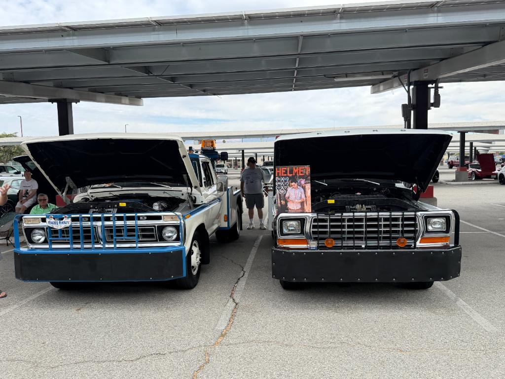 Unit 47 and Larry hoods up with Helmet movie poster — car show